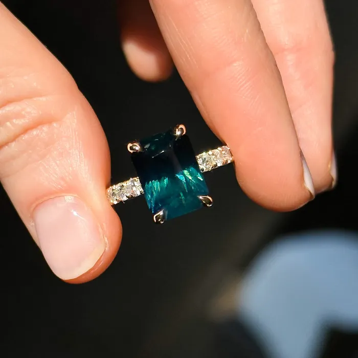 Rings 612ct Deep Teal Blue Madagascar Radiant Cut Sapphire Solitaire Ring with French Set Diamonds in 18k Yellow Gold Anueva Jewelry